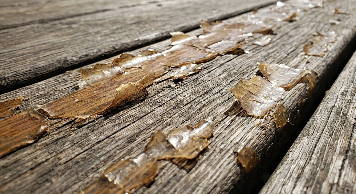 Film finish flaking and peeling off weathered wood boards