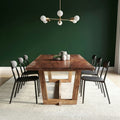 The Brooklyn solid walnut dining table with splayed trestle leg frames, built by M2 Furniture Company