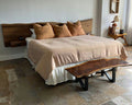 Live edge walnut headboard with floating nightstands built by M2 Furniture Company